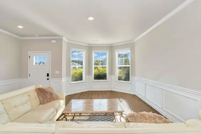 a living room with a couch and a rug