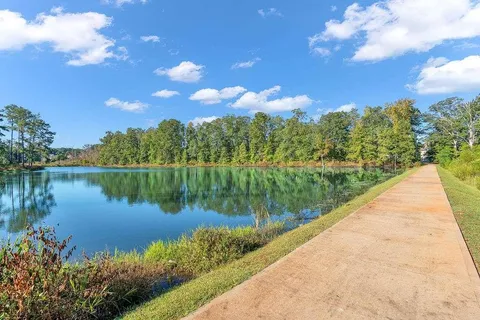 a view of a lake with a yard
