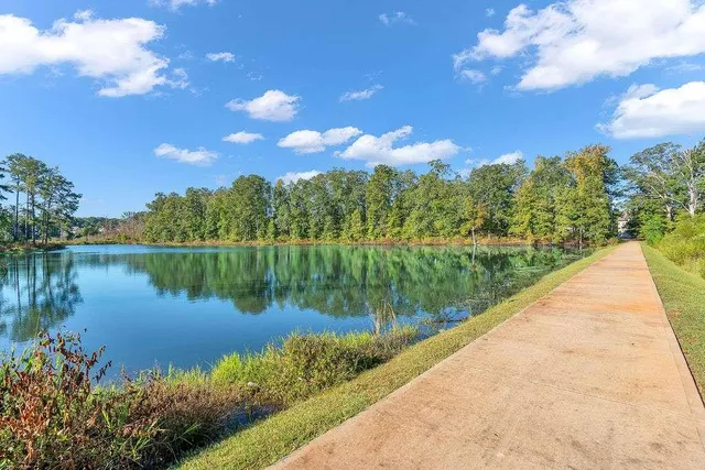 a view of a lake with a yard