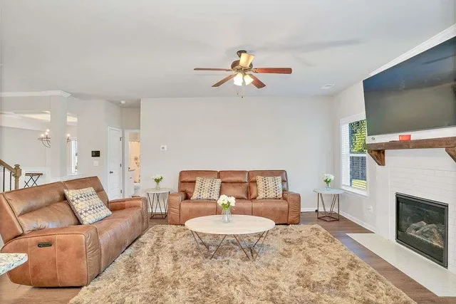 a living room with furniture and a fireplace