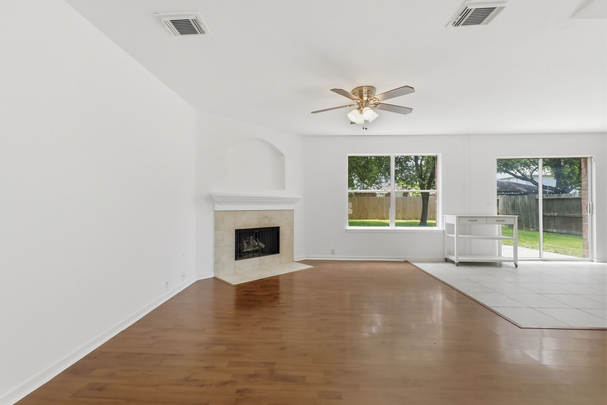 11907 Ezekiel Road Tomball, TX 77375 - Photo 7 of 39 an empty room with windows and fireplace