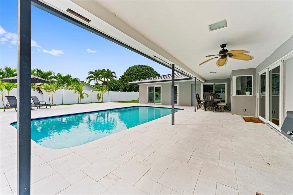 22111 Serenata Circle West Boca Raton, FL 33433 - Photo 15 of 18 a view of a house with a swimming pool