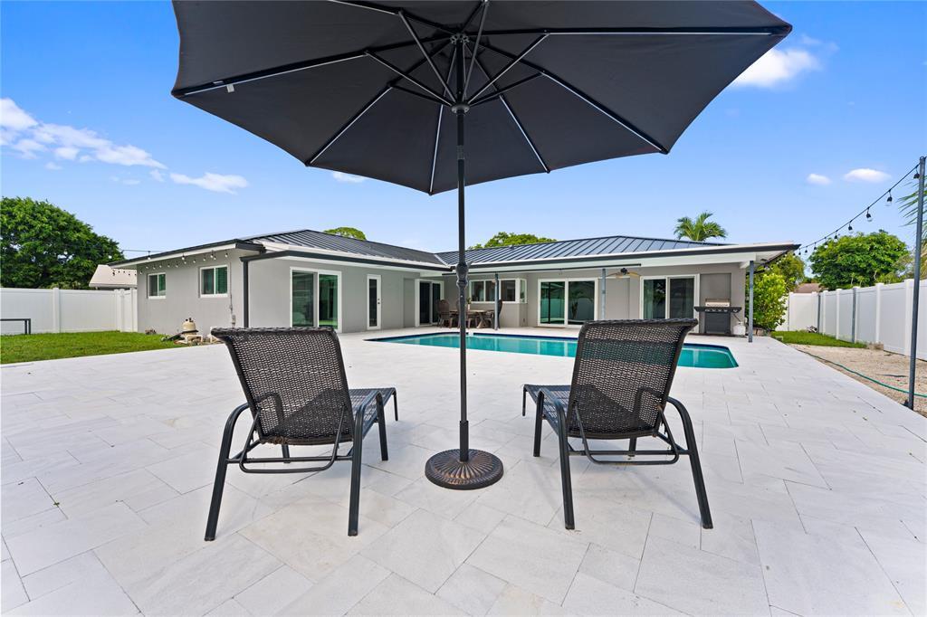 22111 Serenata Circle West Boca Raton, FL 33433 - Photo 16 of 18 a view of a house with backyard and sitting area