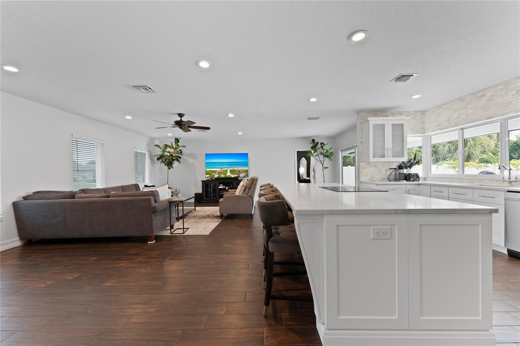 22111 Serenata Circle West Boca Raton, FL 33433 - Photo 6 of 18 a living room with furniture and a wooden floor