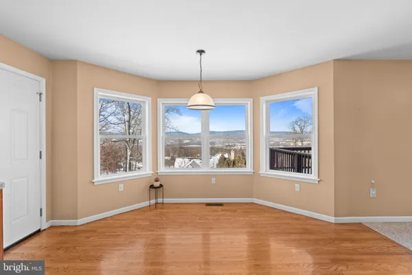 a view of an empty room with glass door