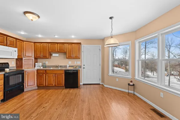 a bathroom with a toilet a sink and vanity