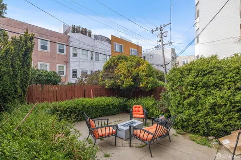 a view of a chairs and table in a patio