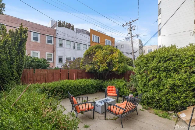 a view of a chairs and table in a patio