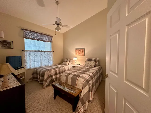 a bedroom with bed and a window