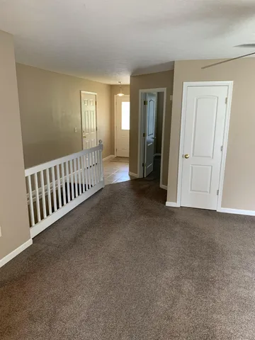 a house that is sitting in the grass