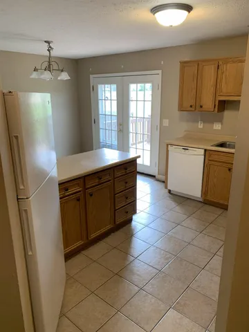 a kitchen with stainless steel appliances a sink stove and refrigerator