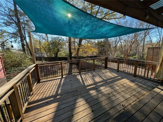 a view of balcony with wooden floor