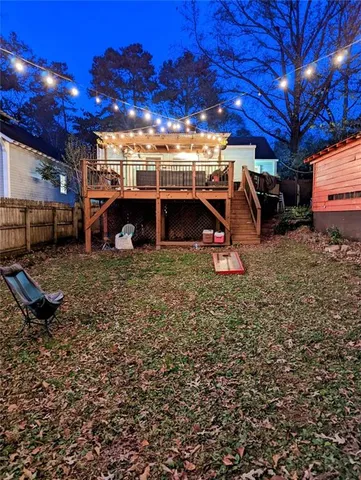 a view of a backyard with a large tree