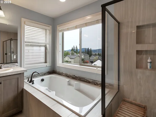 a bathroom with a bathtub and window