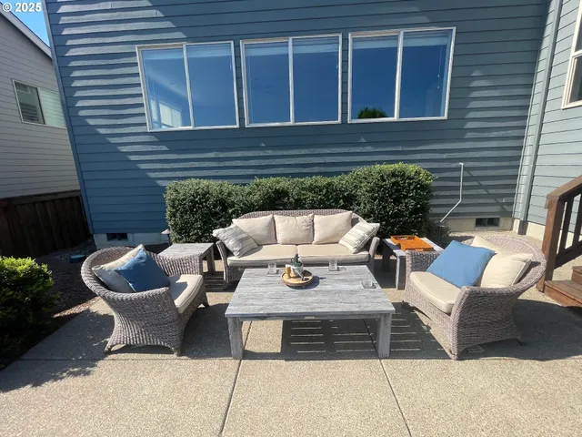 a view of a patio with a dining table and chairs