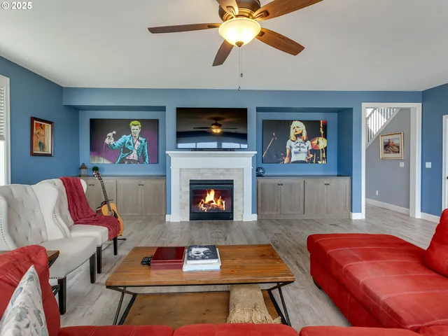 a living room with furniture fireplace and a flat screen tv