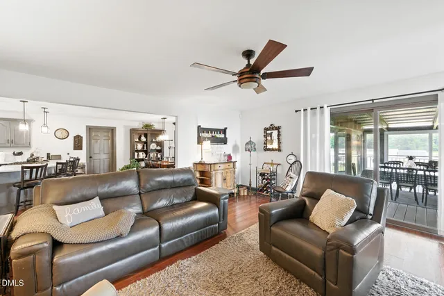a bedroom with furniture and a large window