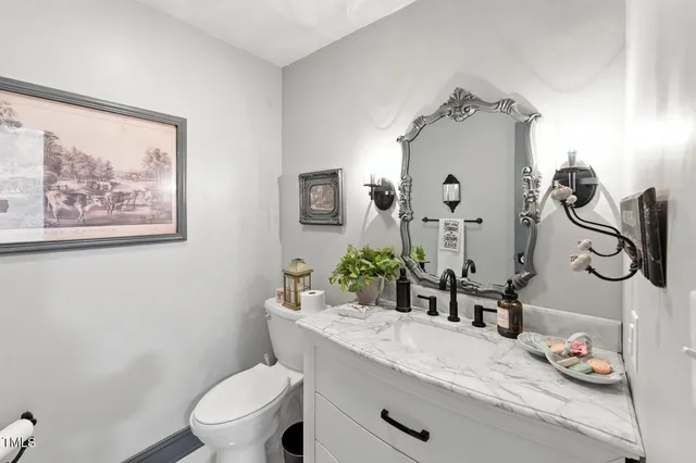 a view of a dining room with furniture large windows and wooden floor