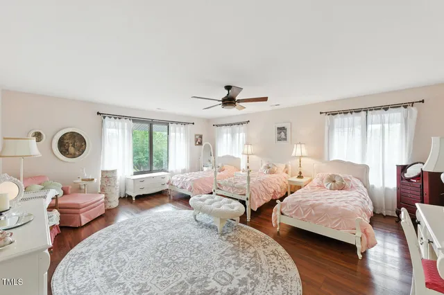 a bedroom with furniture and a wooden floors