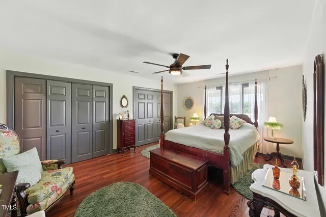 a bedroom with bed and window