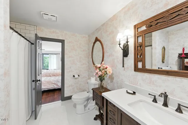 a bedroom with furniture and a wooden floor