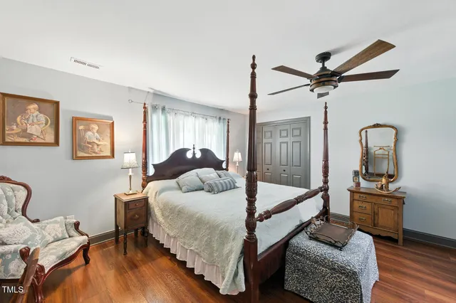 a bathroom with a sink vanity mirror and toilet