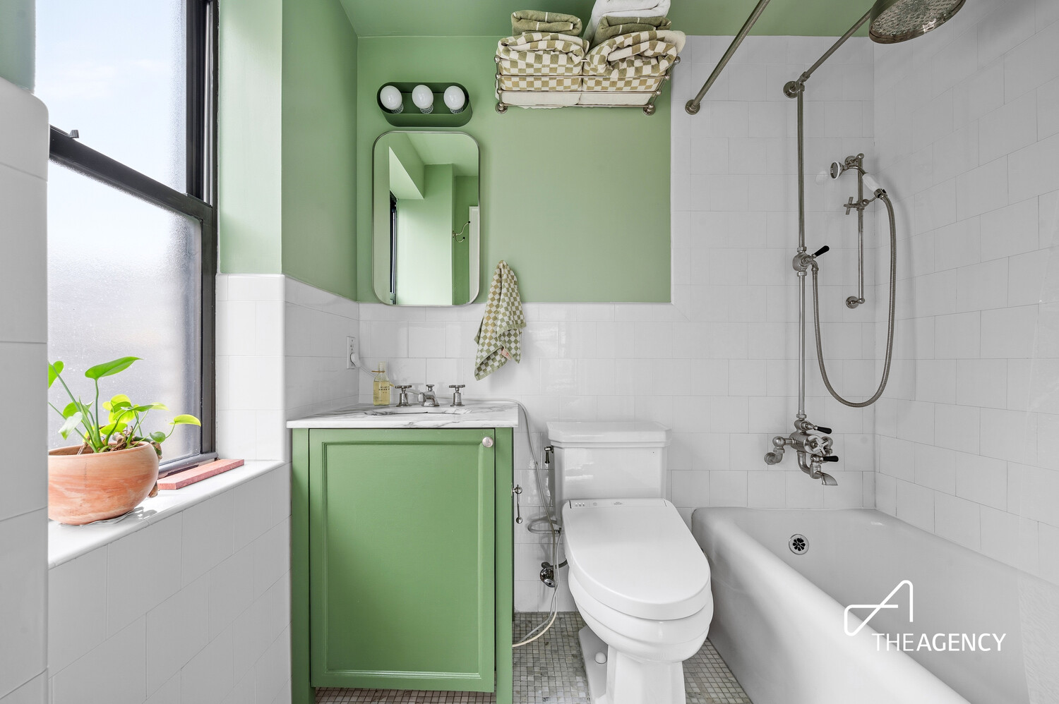 140 East 28th Street, Unit 7H Manhattan, NY 10016 - Photo 6 of 7 a bathroom with a toilet sink and mirror