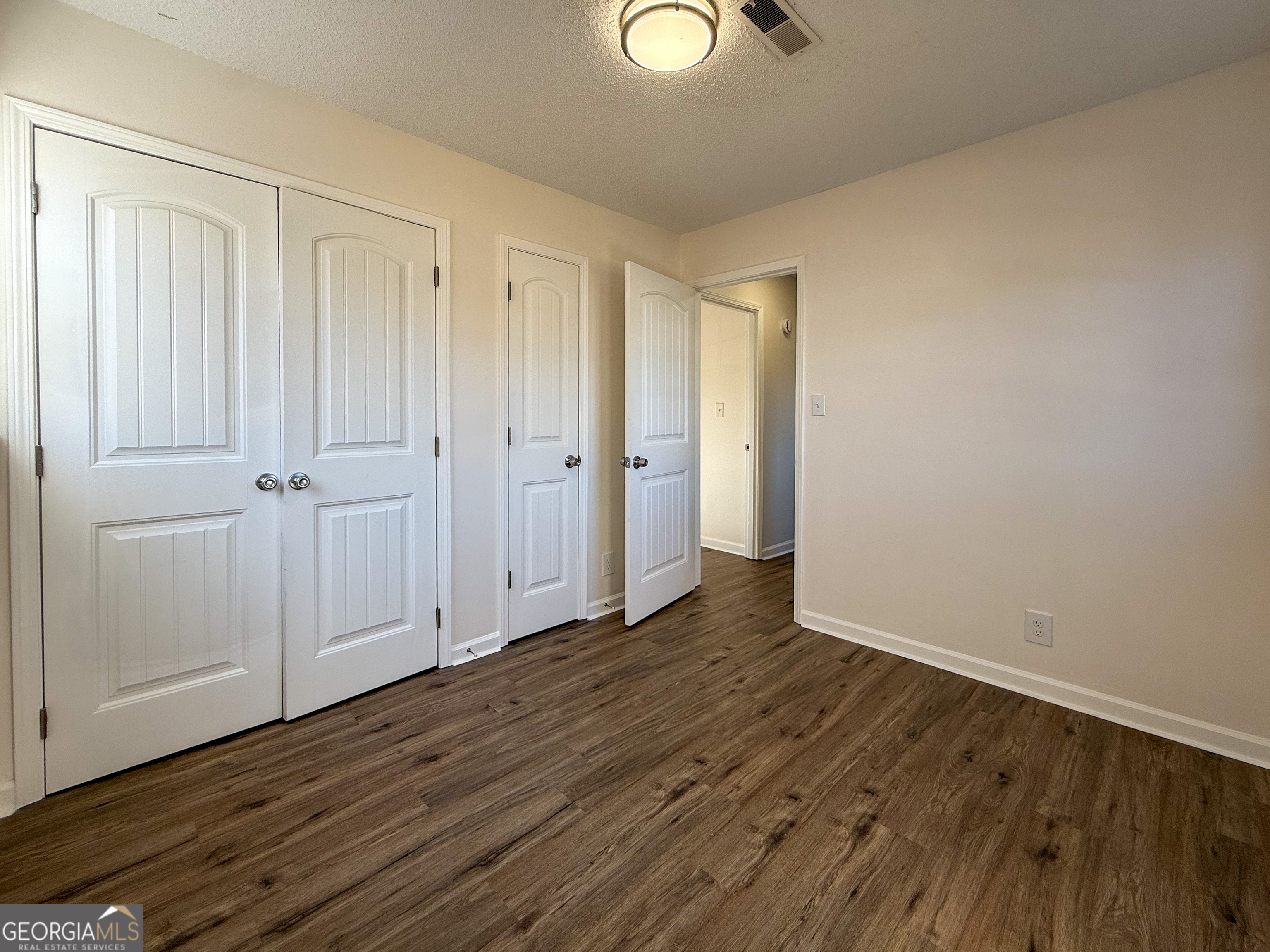 239 East Doyle Street Toccoa, GA 30577 - Photo 16 of 20 a view of a livingroom with wooden floor