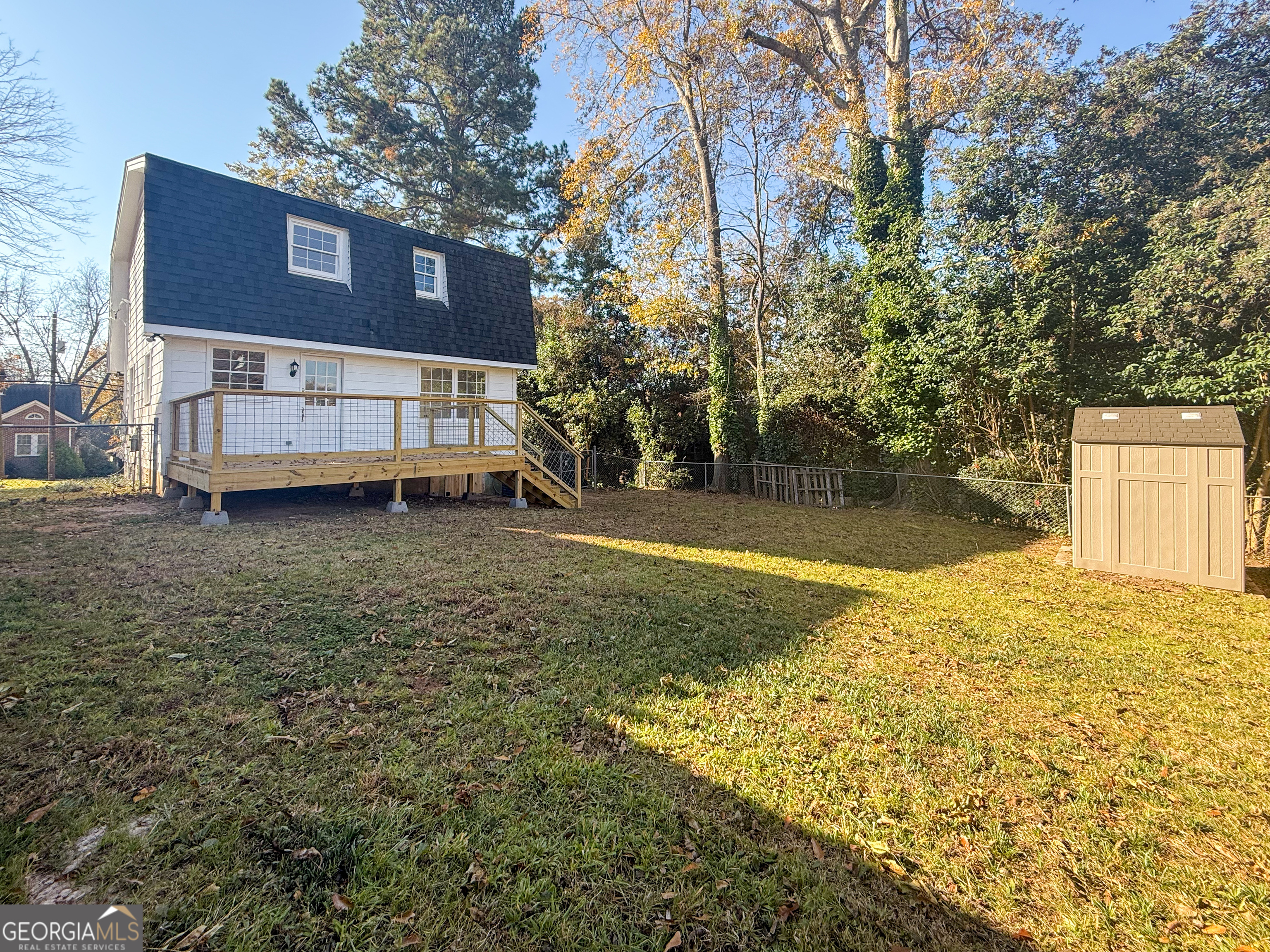 239 East Doyle Street Toccoa, GA 30577 - Photo 19 of 20 a view of a house with a yard and tree s