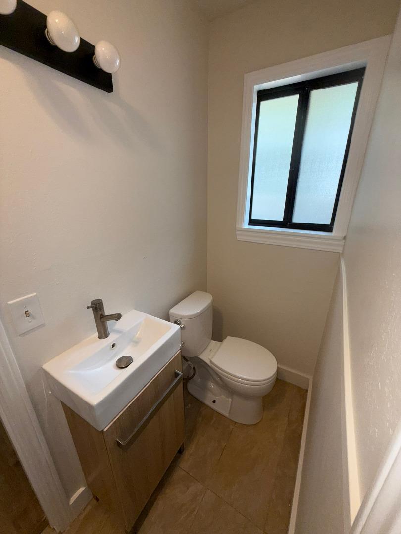 11585 McCarthy Road Carmel Valley, CA 93924 - Photo 37 of 52 a bathroom with a sink a toilet and mirror