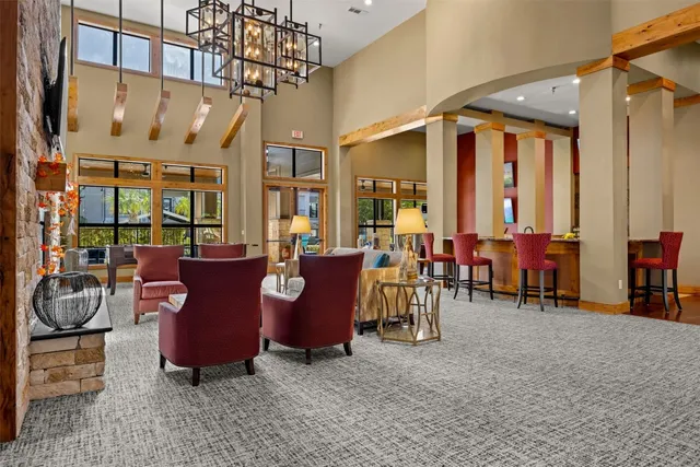 a dining room with a table and chairs