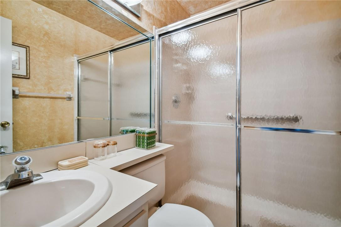 5348 Privet Place, Unit D Delray Beach, FL 33484 - Photo 16 of 60 a bathroom with a sink and a mirror