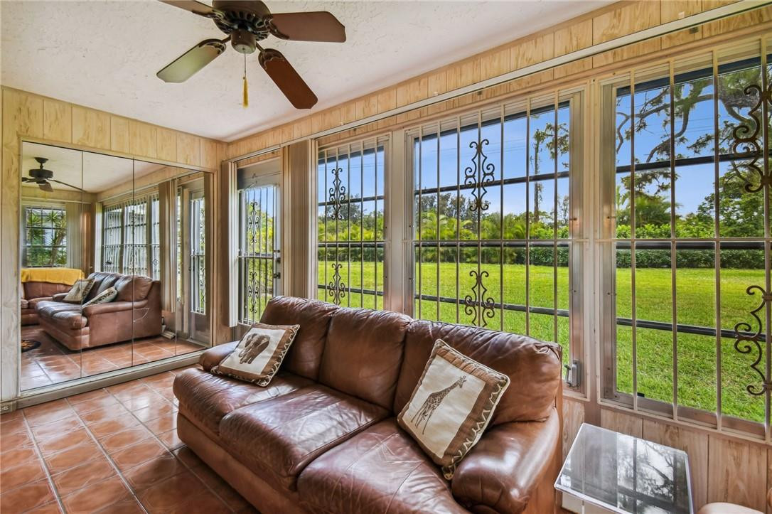 5348 Privet Place, Unit D Delray Beach, FL 33484 - Photo 22 of 60 a living room with furniture and a large window