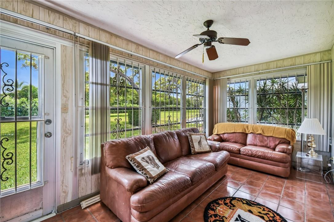5348 Privet Place, Unit D Delray Beach, FL 33484 - Photo 23 of 60 a living room with furniture and a large window