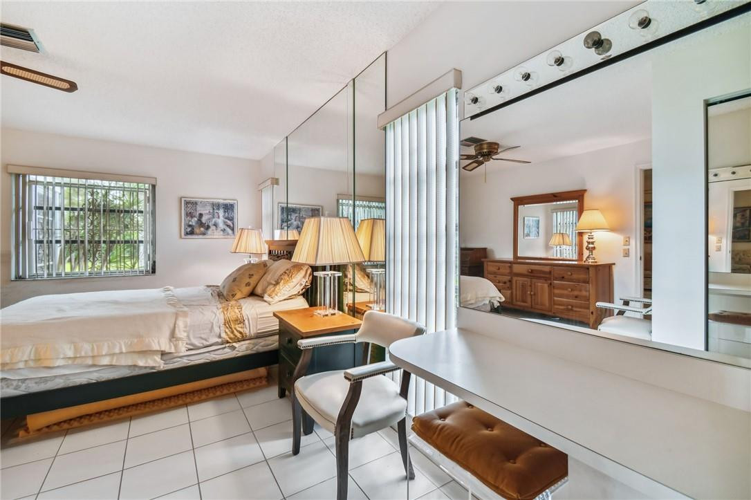 5348 Privet Place, Unit D Delray Beach, FL 33484 - Photo 31 of 60 a living room with furniture and a large window