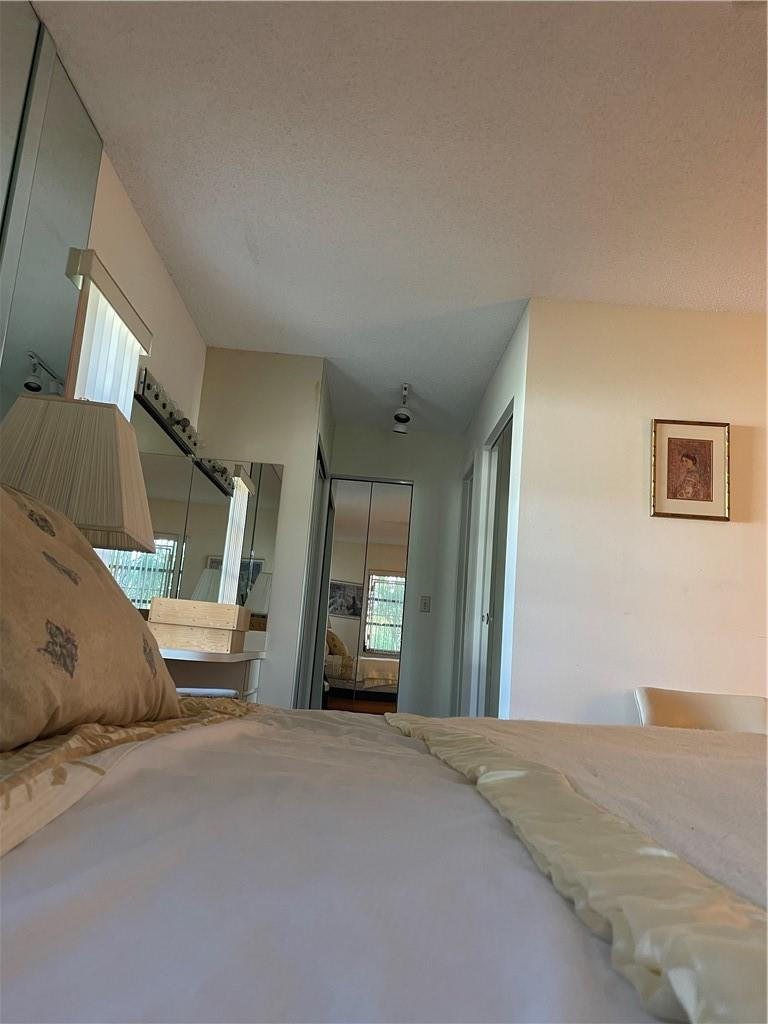 5348 Privet Place, Unit D Delray Beach, FL 33484 - Photo 33 of 60 a bedroom with a bed and a couch