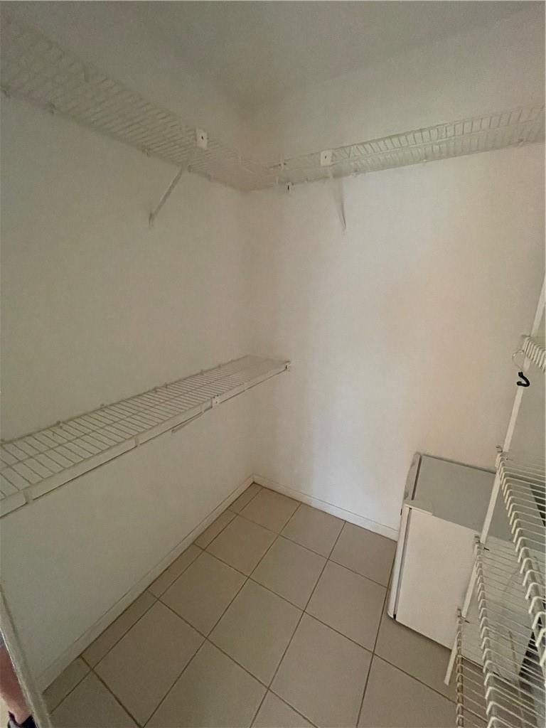 5348 Privet Place, Unit D Delray Beach, FL 33484 - Photo 36 of 60 a view of a room with racks on the wall