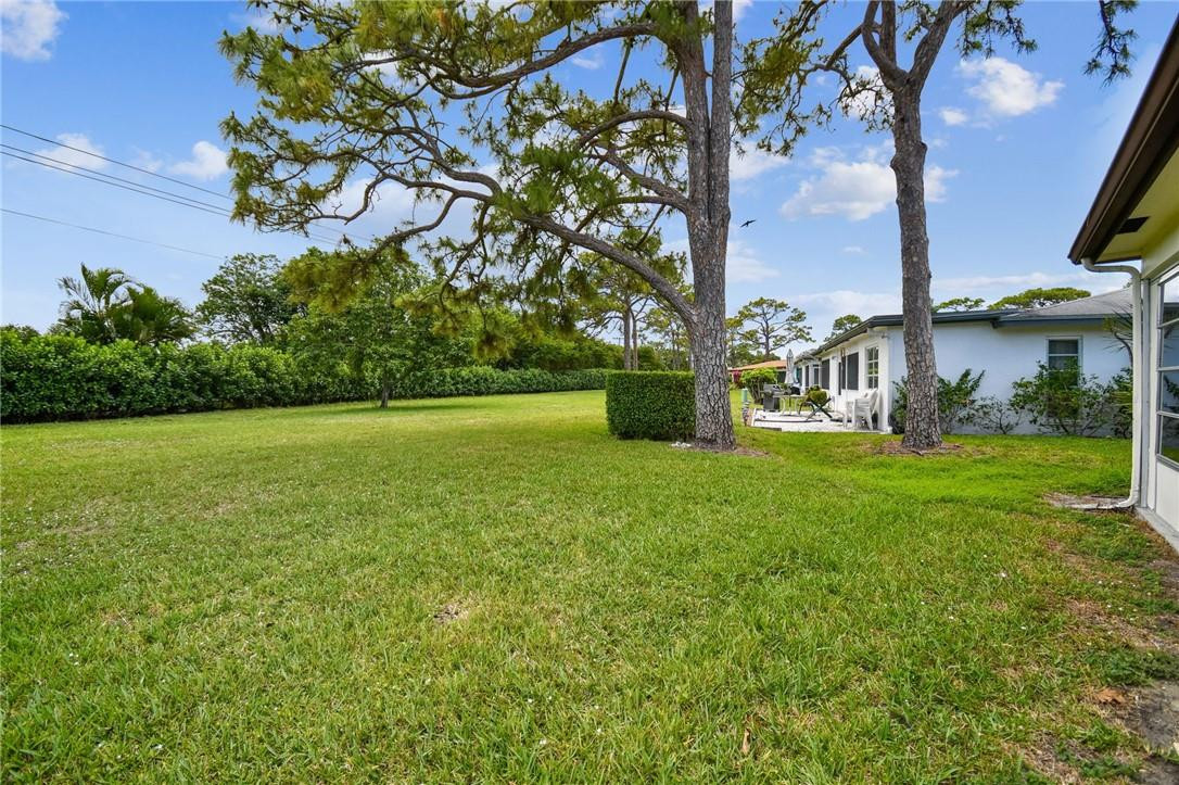 5348 Privet Place, Unit D Delray Beach, FL 33484 - Photo 41 of 60 a view of a house with a yard