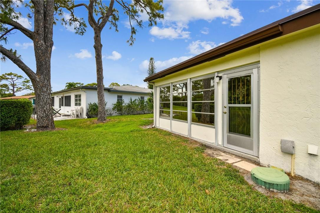 5348 Privet Place, Unit D Delray Beach, FL 33484 - Photo 42 of 60 a view of a house with a backyard