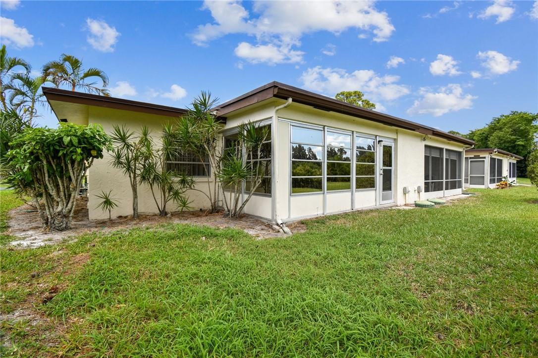 5348 Privet Place, Unit D Delray Beach, FL 33484 - Photo 44 of 60 a view of a house with a yard