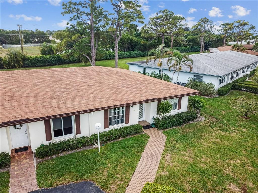 5348 Privet Place, Unit D Delray Beach, FL 33484 - Photo 45 of 60 a house with garden in front of it