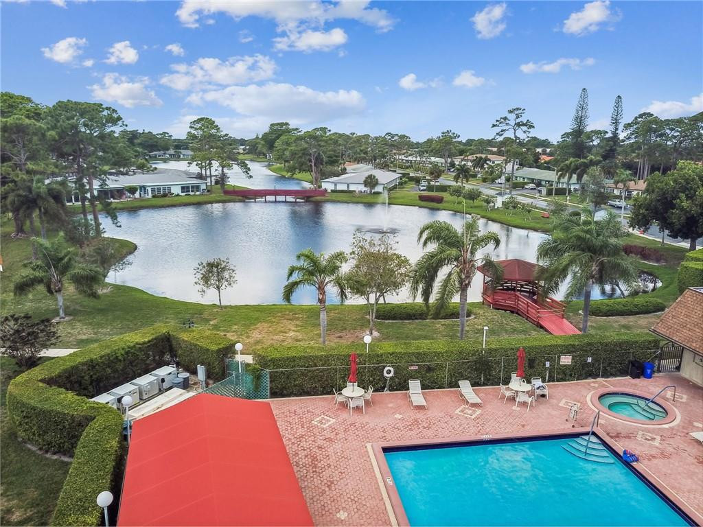 5348 Privet Place, Unit D Delray Beach, FL 33484 - Photo 54 of 60 an aerial view of a house with outdoor space and a lake view in back