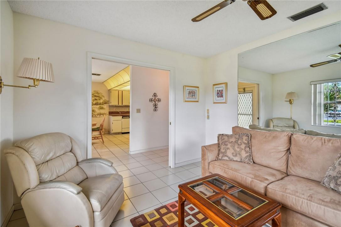 5348 Privet Place, Unit D Delray Beach, FL 33484 - Photo 7 of 60 a living room with furniture and a couch