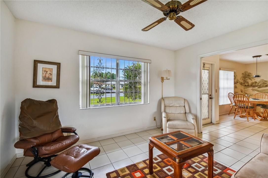 5348 Privet Place, Unit D Delray Beach, FL 33484 - Photo 8 of 60 a living room with furniture and a window