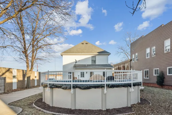 a view of house with yard and entertaining space