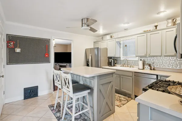 a kitchen with a table and chairs in it