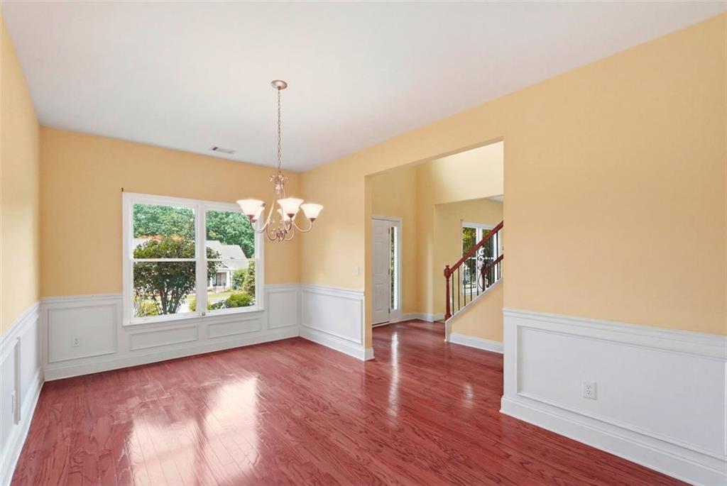 3420 Bulloch Lake Road Loganville, GA 30052 - Photo 5 of 57 a view of a room with wooden floor fireplace and windows