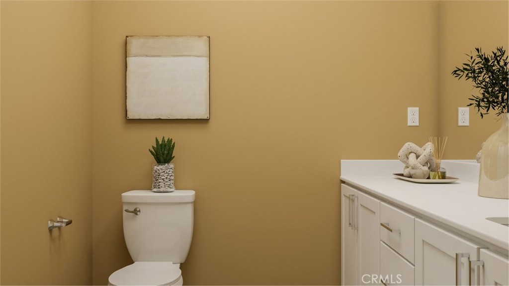2209 Rivington Irvine, CA 92612 - Photo 8 of 20 a bathroom with a toilet sink and mirror