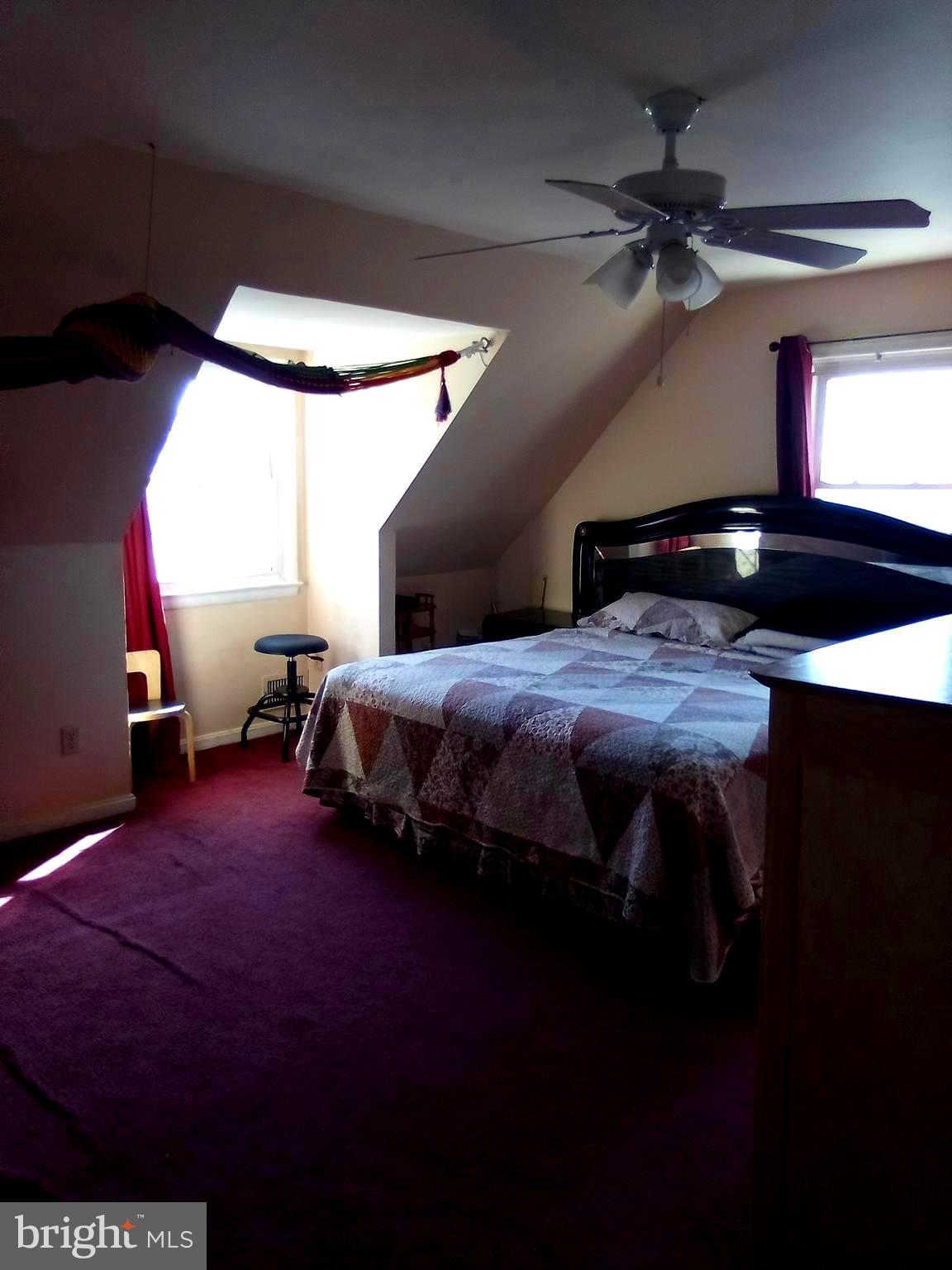 2409 Randolph Road Silver Spring, MD 20902 - Photo 8 of 43 a bedroom with a bed and a ceiling fan