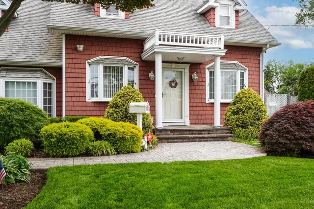 a front view of a house with garden
